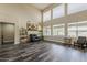 Bright and airy living room with a view of the landscaped backyard and pool area at 3062 E Cullumber St, Gilbert, AZ 85234