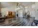 Large open-concept living room featuring high ceilings, staircase, and dark wood flooring at 3062 E Cullumber St, Gilbert, AZ 85234