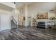Spacious living room with staircase, high ceilings, decor shelving, and dark wood floors at 3062 E Cullumber St, Gilbert, AZ 85234