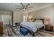 Serene main bedroom features a comfortable bed, soft lighting, and a ceiling fan at 3062 E Cullumber St, Gilbert, AZ 85234