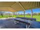 Covered park pavilion featuring picnic tables, providing a shaded area for outdoor gatherings and relaxation at 3062 E Cullumber St, Gilbert, AZ 85234