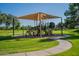 Neighborhood playground with a shaded play structure, providing a fun and safe environment for children at 3062 E Cullumber St, Gilbert, AZ 85234