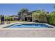 A stunning backyard pool with ample seating, covered patio and refreshing blue water at 3062 E Cullumber St, Gilbert, AZ 85234