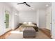 Serene bedroom with wood floors, ample natural light, and comfortable furnishings at 3150 E Beardsley Rd # 1081, Phoenix, AZ 85050