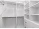 Bright white walk-in closet offers ample storage with adjustable shelves and hanging rods at 3150 E Beardsley Rd # 1081, Phoenix, AZ 85050
