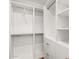 Bright white walk-in closet offers ample storage with adjustable shelves and hanging rods at 3150 E Beardsley Rd # 1081, Phoenix, AZ 85050