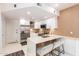 Open kitchen with a breakfast bar, modern appliances, and elegant finishes at 3150 E Beardsley Rd # 1081, Phoenix, AZ 85050