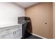 Modern laundry room with sleek, high-end appliances and stylish design at 3150 E Beardsley Rd # 1081, Phoenix, AZ 85050