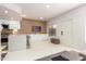 Spacious living area featuring modern furniture and a view of the kitchen area at 3150 E Beardsley Rd # 1081, Phoenix, AZ 85050