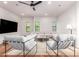 Spacious living room with modern furnishings, wood floors, natural light, and ceiling fan at 3150 E Beardsley Rd # 1081, Phoenix, AZ 85050