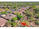Scenic aerial view of a desert community with lush landscaping and beautiful tile roof homes at 32710 N 71St St, Scottsdale, AZ 85266