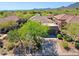 Aerial view of home featuring mature desert landscaping, tile roof, and community at 32710 N 71St St, Scottsdale, AZ 85266