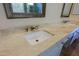 Elegant bathroom vanity featuring a white undermount sink, beautiful marble countertop, and modern faucet at 32710 N 71St St, Scottsdale, AZ 85266