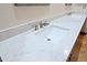 Elegant bathroom vanity featuring a white undermount sink, beautiful marble countertop, and modern faucet at 32710 N 71St St, Scottsdale, AZ 85266