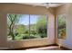Bright bedroom featuring a large window with views of the beautifully landscaped backyard at 32710 N 71St St, Scottsdale, AZ 85266