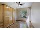 Light filled bedroom with a large window and built-in wardrobe at 32710 N 71St St, Scottsdale, AZ 85266