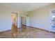Spacious primary bedroom with tile flooring and a doorway leading to the ensuite bath at 32710 N 71St St, Scottsdale, AZ 85266