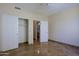 Bedroom featuring tiled floors, ceiling fan and standard closet at 32710 N 71St St, Scottsdale, AZ 85266