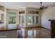 Bright dining area with large windows, granite countertops, and a kitchen island at 32710 N 71St St, Scottsdale, AZ 85266