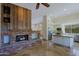 Open floor plan featuring a living room with stone fireplace and an island kitchen at 32710 N 71St St, Scottsdale, AZ 85266