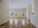 The living room boasts neutral walls, a chandelier, marble floors, and access to other rooms at 32710 N 71St St, Scottsdale, AZ 85266