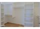 Spacious walk-in closet with custom shelving and hanging rods, perfect for organizing your wardrobe at 32710 N 71St St, Scottsdale, AZ 85266