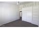 Bedroom featuring a ceiling fan, carpeted flooring, built-in loft, and closet at 3314 E Draper Cir, Mesa, AZ 85213