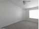 Bedroom with neutral carpet, window, and a ceiling fan at 3314 E Draper Cir, Mesa, AZ 85213