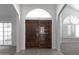 Elegant entryway with double doors and bright sidelight windows at 3314 E Draper Cir, Mesa, AZ 85213