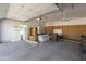Large, organized garage space with storage cabinets and a utility sink at 3314 E Draper Cir, Mesa, AZ 85213