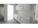 Hallway with built-in storage and access to other rooms at 3314 E Draper Cir, Mesa, AZ 85213