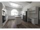 Bright, spacious kitchen with stainless steel appliances and an island at 3314 E Draper Cir, Mesa, AZ 85213