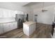 Spacious kitchen features stainless steel appliances, ample counter space, and modern flooring at 3314 E Draper Cir, Mesa, AZ 85213