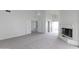 Bright and airy living room with high ceilings, fireplace, and multiple entryways at 3314 E Draper Cir, Mesa, AZ 85213