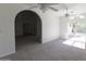 Spacious living room with an archway and a sliding door to the backyard at 3314 E Draper Cir, Mesa, AZ 85213