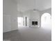 Spacious living room featuring a fireplace and natural light at 3314 E Draper Cir, Mesa, AZ 85213