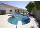 Backyard swimming pool with diving board, tiled spa, and views of the home's covered patio at 3314 E Draper Cir, Mesa, AZ 85213