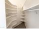 Walk-in closet with custom shelving at 3314 E Draper Cir, Mesa, AZ 85213