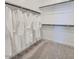 Spacious walk-in closet featuring multiple rods for hanging clothes and carpet flooring for added comfort and style at 3341 S Lily Ave, Mesa, AZ 85212