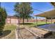 Spacious backyard features a covered patio, garden beds, mature trees, and plenty of room to roam at 3344 N 62Nd Pl, Scottsdale, AZ 85251