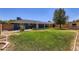 This well-maintained backyard includes lawn, patio, privacy fencing, and a mature shade tree at 3344 N 62Nd Pl, Scottsdale, AZ 85251