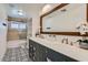 Stylish bathroom features double sinks, modern fixtures, and decorative tile flooring for a luxurious feel at 3344 N 62Nd Pl, Scottsdale, AZ 85251