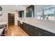 Bright kitchen featuring white marble countertops, dark green cabinets, and stainless steel appliances at 3344 N 62Nd Pl, Scottsdale, AZ 85251