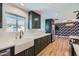 Beautiful kitchen featuring sleek cabinetry, a farmhouse sink, stainless steel appliances, and quartz countertops at 3344 N 62Nd Pl, Scottsdale, AZ 85251