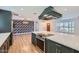Bright and spacious kitchen featuring a marble island and a view into the living room at 3344 N 62Nd Pl, Scottsdale, AZ 85251
