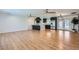 Bright and airy living area showcasing wood floors, an open layout, recessed lighting and a modern kitchen at 3344 N 62Nd Pl, Scottsdale, AZ 85251