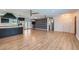 Bright and spacious living area with wood floors, statement wallpaper and a stylish open layout at 3344 N 62Nd Pl, Scottsdale, AZ 85251