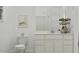 Fresh, minimalist bathroom with white vanity, toilet, decor and neutral accents for a clean, modern look at 3780 E Gold Mountain Ave, San Tan Valley, AZ 85143