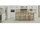 Bright, modern kitchen features a large island with barstool seating and stainless steel appliances at 3780 E Gold Mountain Ave, San Tan Valley, AZ 85143