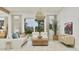 Bright living room boasts modern furniture, natural lighting and sliding glass door access to the outdoors at 3780 E Gold Mountain Ave, San Tan Valley, AZ 85143